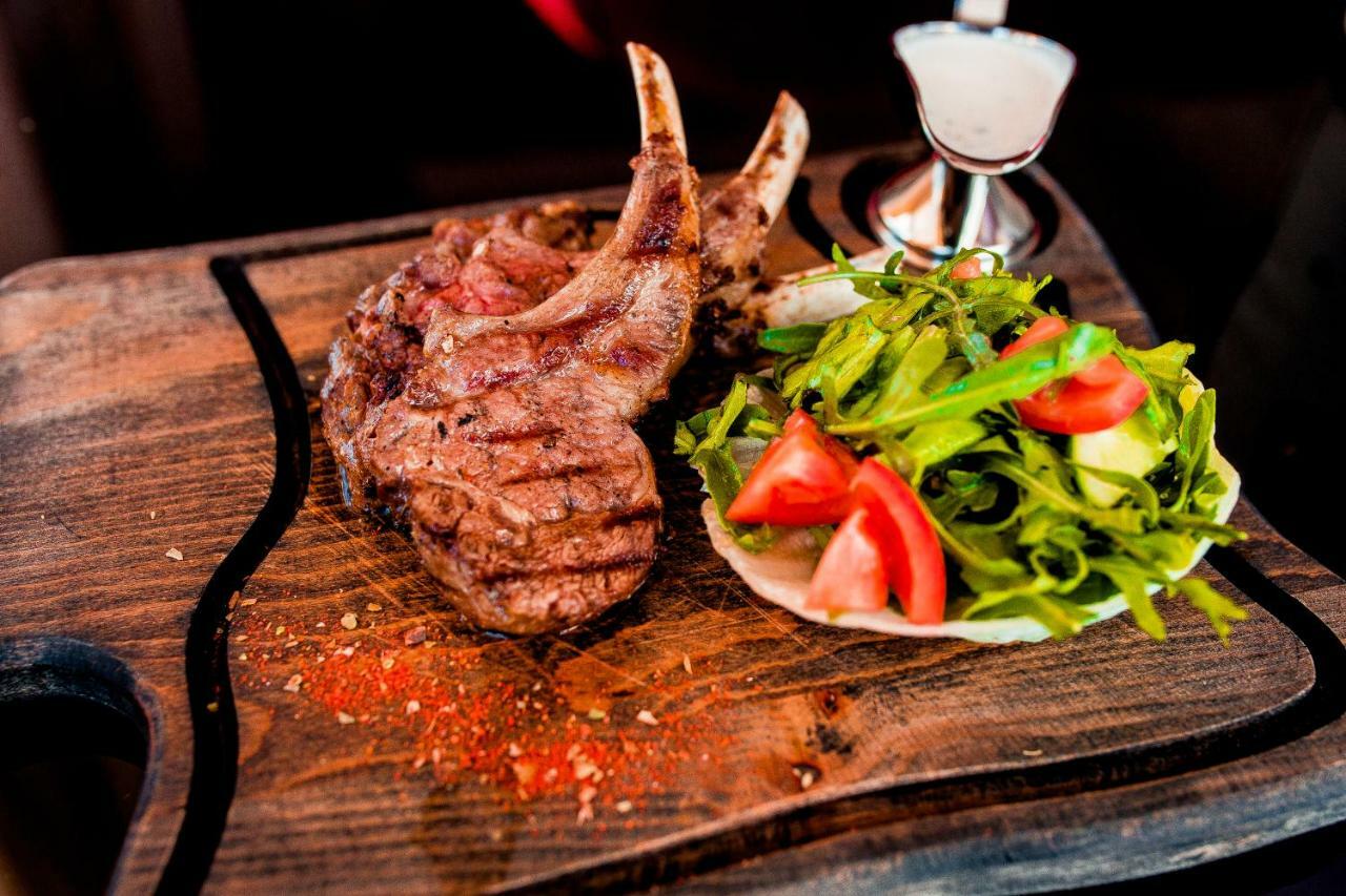 Отель Caspian Riviera Grand Palace Актау Экстерьер фото A grilled lamb chop with a fresh salad